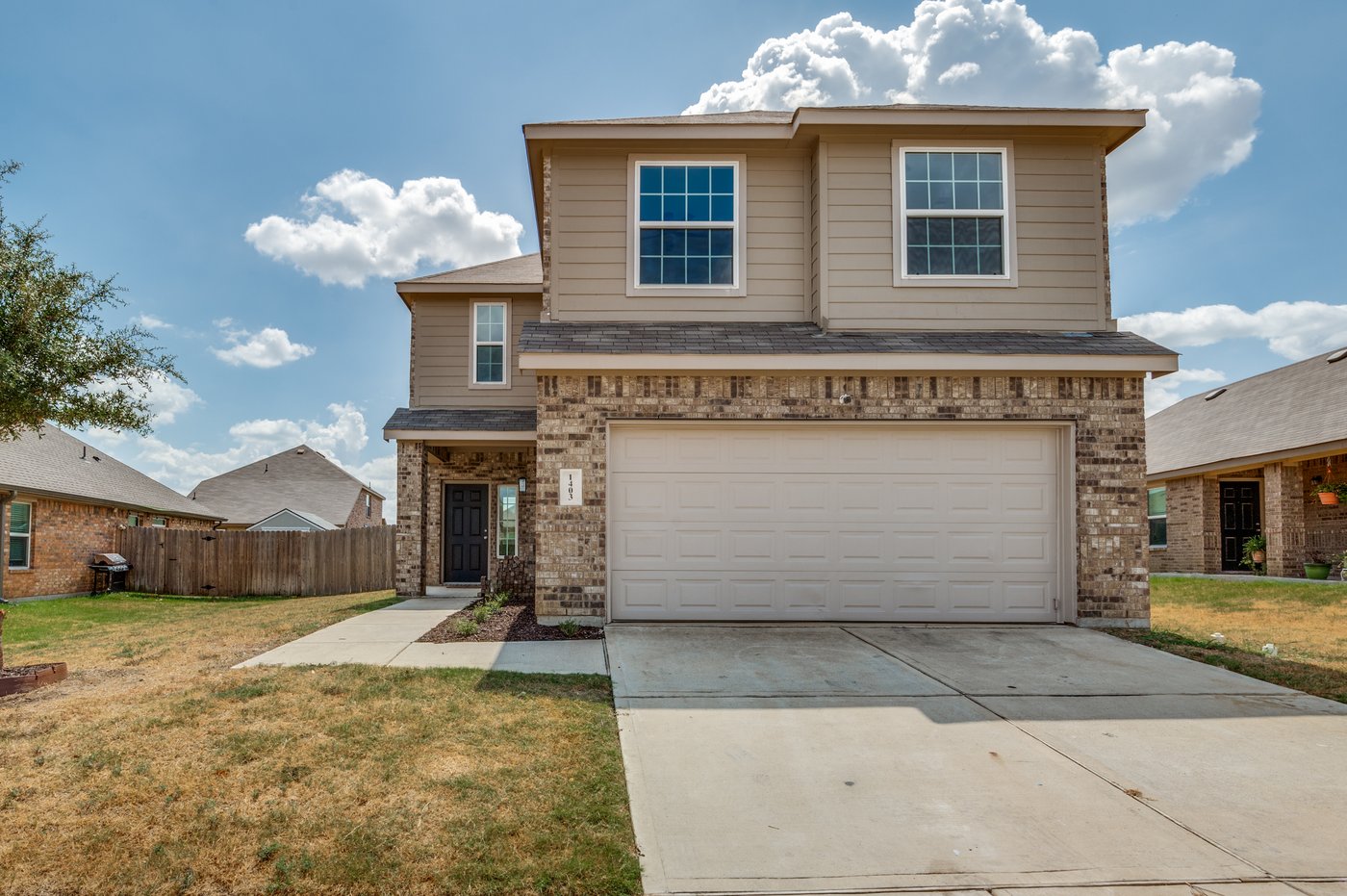 1403 Kinglet Dr, Ennis TX two story brick and stone home for sale