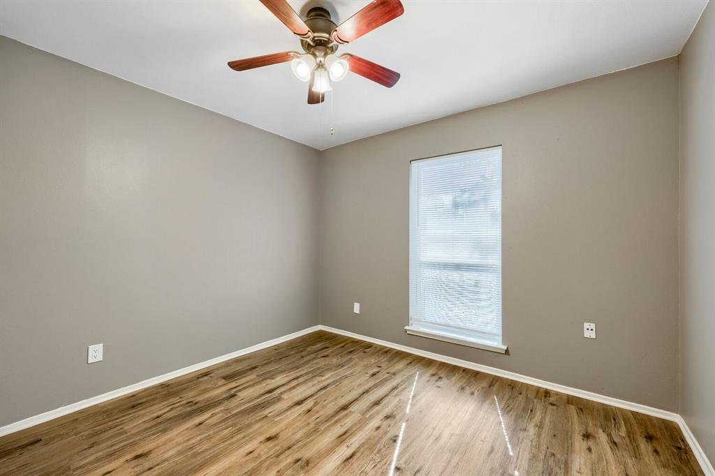 Second bedroom with a ceiling fan at 22 E Townhouse Ln #31, Grand Prairie