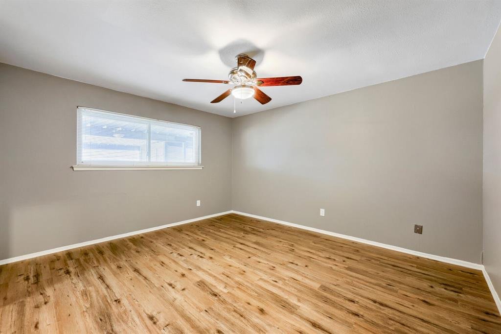 Third bedroom with a ceiling fan at 22 E Townhouse Ln #31, Grand Prairie