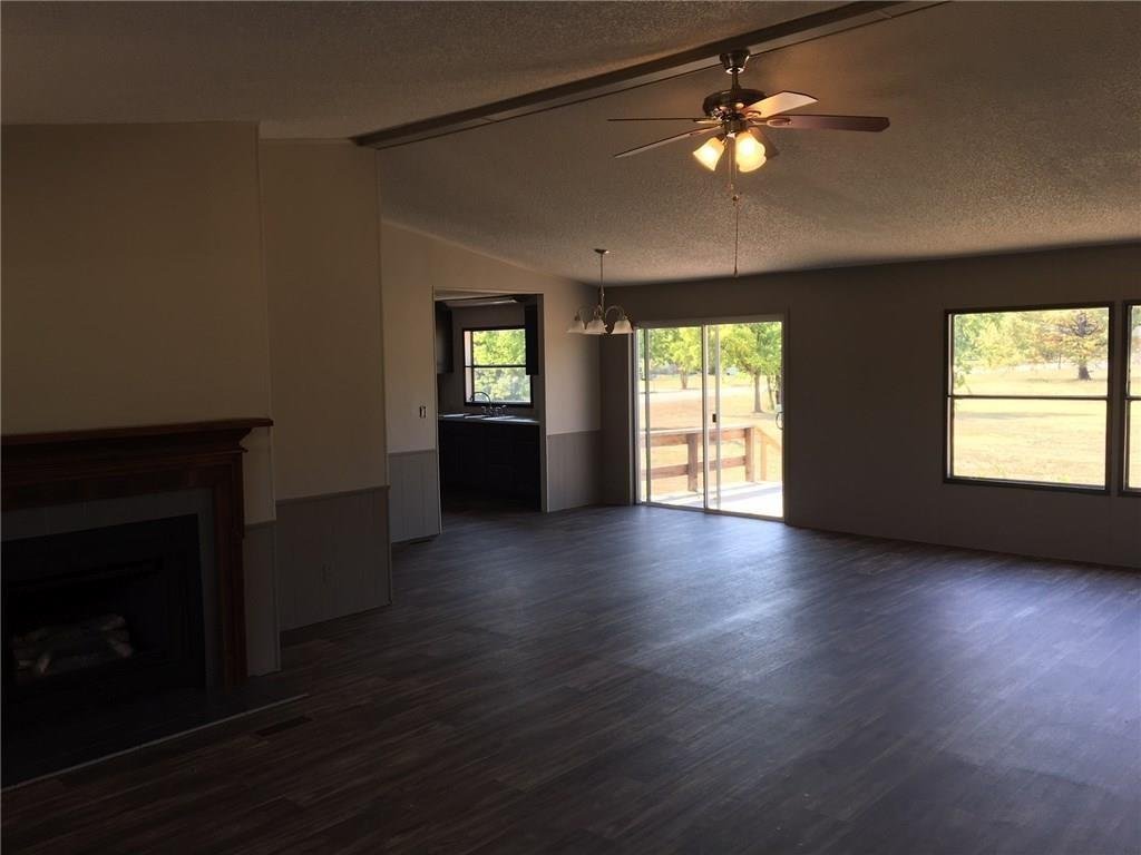 Open living area with a fireplace and laminate flooring at 365 Darrell Rd, Roanoke