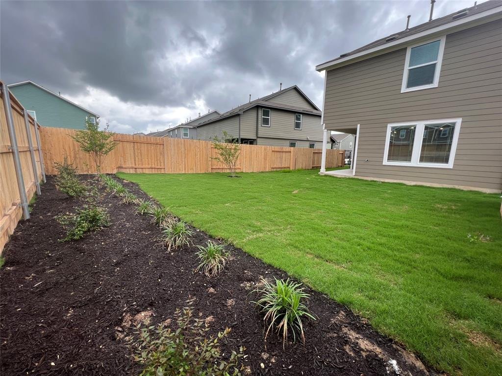 Fenced backyard at 7224 Spotted Leaf Way in Del Valle