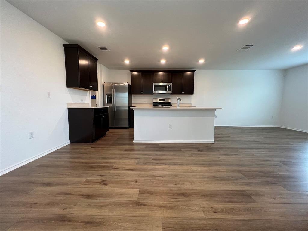 Kitchen with modern appliances and sleek countertops at 7224 Spotted Leaf Way in Del Valle